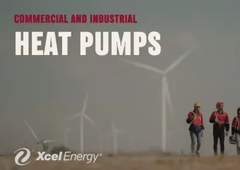 Contractors walking through a wind farm