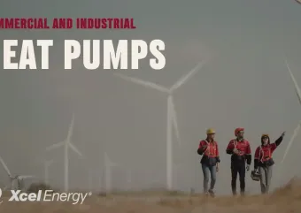 Contractors walking through a wind farm